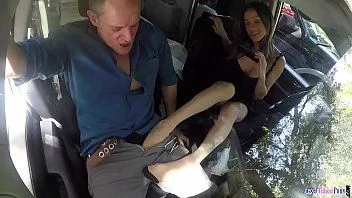 Play Footsie babe pleasures cock in the car